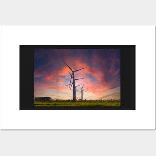 Windmill farm on green meadow under moody red sky Posters and Art